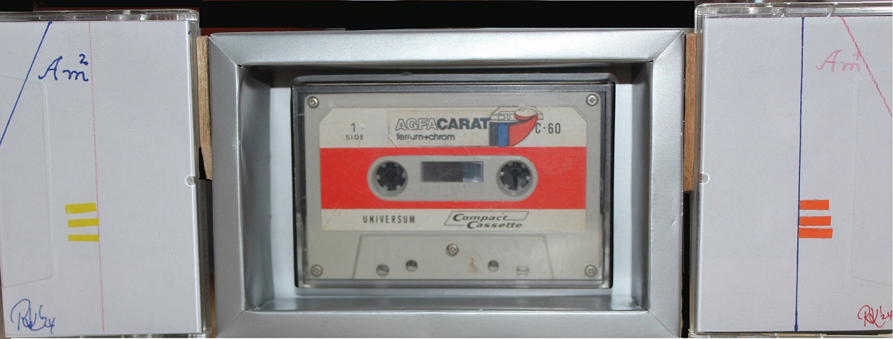 Am2 - ca. 30 x 11 x 4 cms. Music Cassettes Plastic 2x CrO2 high quality C-90 (each plays 11 Min. of 5 different songs (Am1) and 3 different ones (Am2)) and one C10 Low Noise (still playing well!) with one recorded piece: SoftSpring (1979, March) box built from 1971 - 2019, ca. 10 x 16 x 3,6 cms. Wood, Carton, fitted Plastic box inside can be opened to take cassette out of it. Signed. unique Cover artwork in plastic Case, Paper in different colors, Pencil, Ballpoint pen, Print RAC 1990, handwritten contents, recorded without Dolby, signed, ready to play!