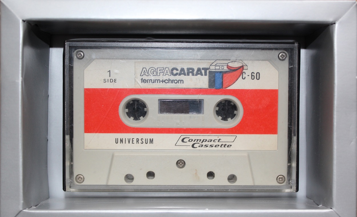 C10_SoftSpring - My 1st Compact Cassette from 1971 - A now C10 Low Noise (still playing good!) with one recorded piece: SoftSpring (1979, March) box built from 1971 - 2019, ca. 10 x 16 x 3,6 cms. Wood, Carton, fitted Plastic box inside can be opened to take cassette out of it. Signed